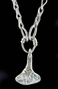 10th C. Viking Silver Necklace w/ Thor's Hammer: Northern Europe, Viking / Norse culture, ca. 10th to 12th century CE. A stunning 98% silver necklace featuring a substantial, long chain composed of skillfully composed interconnecting links and a