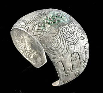 10th C. Viking Orupgard Incised Silver Cuff Bracelet: Northern Europe, Denmark, Orupgard, Viking, ca. 10th century CE. A stunning and quite substantive silver bracelet - comprised of almost pure silver (99% silver) - presenting a torque form and a broad