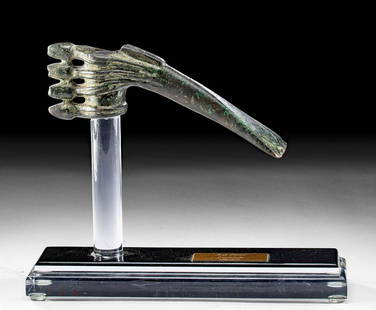 Luristan Bronze Axe Head w/ Short Spikes: Ancient Near East, Northwestern Iran, Luristan, ca. 1200 to 800 BCE. A superb cast-bronze axe head with short spikes, a hafting socket, and a narrow blade. The cylindrical shaft has four ribs with