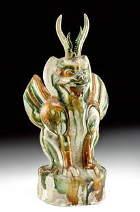 Chinese Tang Sancai Pottery Earth Spirit, ex-Christie's: East Asia, China, Tang Dynasty, ca. 618 to 906 CE. A magnificent guardian figure called a zhenmushou (grave-quelling beast) or earth spirit presenting a characteristic fantastical hybrid,