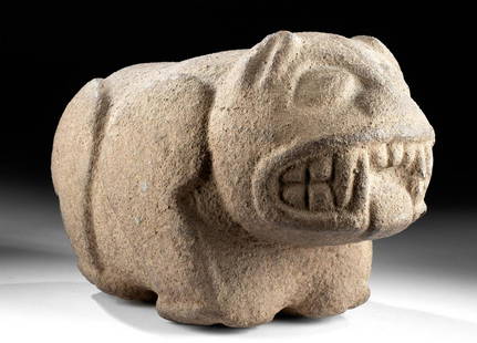 Maya Stone Jaguar - Carved in the Round: Pre-Columbian, Guatemala, Maya, ca. 550 to 900 CE. Skillfully carved in the round from a single hefty stone, a jaguar perched upon all four legs and glaring out at the viewer with a formidable