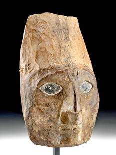 Huari Wood Mummy Mask - A Mesmerizing Countenance: Pre-Columbian, Central Coast Peru, Huari (Wari), ca. 700 to 1000 CE. A skillfully carved wooden "false mummy head" mask with an expressive visage that is embellished with a thick layer of cinnabar
