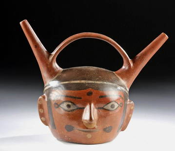 Huari Polychrome Bridge Spout Portrait Vessel: Pre-Columbian, Peru, Huari/Wari, ca. 700 to 1000 CE. An extremely rare and realistic double-spouted portrait stirrup vessel - unusual as most ancient Peruvian portrait vessels were created by the