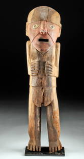 Huari / Wari Wood Carving of a Woman: Pre-Columbian, Central Coast Peru, Huari/Wari, ca. 700 to 1000 CE. A dramatic wood carving of an abstract female figure, standing with both hands to her chest, her mouth open wide as if she is
