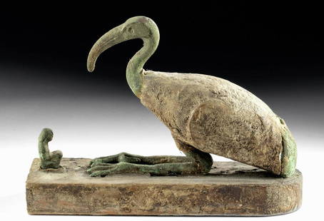 Egyptian Gesso'd Wood / Bronze Sacred Ibis + Worshipper: Ancient Egypt, Third Intermediate to Late Dynastic Period, ca. 1070 to 332 BCE. A wonderfully preserved sacred ibis, of the style found in the tombs of scribes, associated with the deity Djehuty or