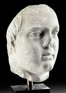 Lifesize Ptolemaic Hellenistic Marble Head, ex-Bonhams: Greek Egypt, Hellenistic / Ptolemaic Period, ca. 2nd to 1st century BCE. A lifelike and lifesize marble rendering of the face of a ruler, probably one of the Ptolemies, carved with strong features,