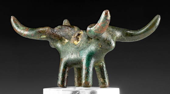 Rare / Published Greek Geometric Bronze Bull: Italic or Greek, Geometric period, ca. 8th to 7th century BCE. An incredibly rare, double-headed, leaded bronze bull, finely cast via the lost wax (cire perdue) process. Notice a suspension loop, now