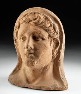 Exhibited Etruscan Molded Terracotta Head of Woman TL'd: Classical World, Etruria (Central Italy), ca. 600 BCE. A terracotta bust in the classic Etruscan style, presenting a bust of a woman with an attractive visage comprised of delicate and strikingly natu