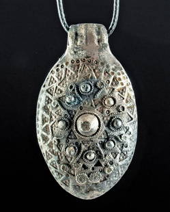 Gorgeous 9th C. Viking Silver Ovoid Pendant: Northern Europe, Scandinavia, Viking or Norse culture, ca. 9th to 11th century CE. A stunning, hollow-formed pendant of an ovoid form shaped from 73% silver with a 90.5% silver back panel. Displayed