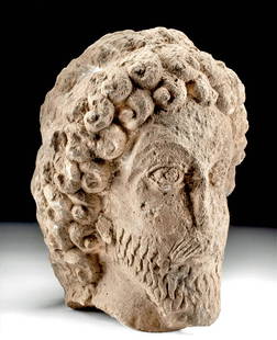 Published / Exhibited Parthian Limestone Head: Ancient Near East, Parthia, ca. 200 to 100 BCE. A finely carved limestone funerary head, possibly portraying a Parthian king from Dura Europos. The head is quite large and well executed with a