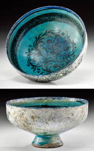 Kashan Turquoise Glazed Silhouette Bowl, ex-Christie's: Near East, Persia/Iran, Seljuq Empire (Seljuk, Saljuq), Kashan, ca. early 13th century CE. A striking bowl featuring a deep turquoise blue glaze over a black manganese painted surface. The bowl