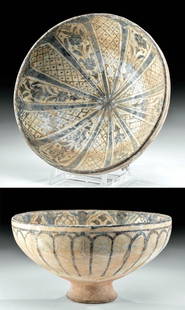 Il-Khanid Glazed Pottery Bowl - ex Sotheby's: Western Asia, Persia (Iran) or possibly Syria, Ilkhanid (Il-Khanid, Ilkhanate), ca. 14th century CE. An ornately decorated ceramic bowl, of a classic hemispheric form with a concave pedestal foot.