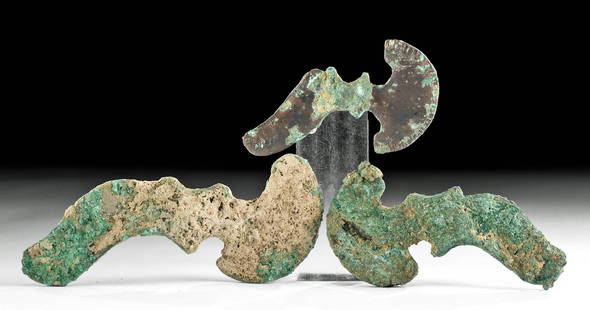 Lot of 3 Ancient Luristan Bronze Axe Heads: Ancient Near East, northwestern Iran, Luristan, ca. 1000 to 600 BCE. A lovely set of three forged-bronze axe heads of varying sizes from ancient Luristan. The first weapon features incised striations
