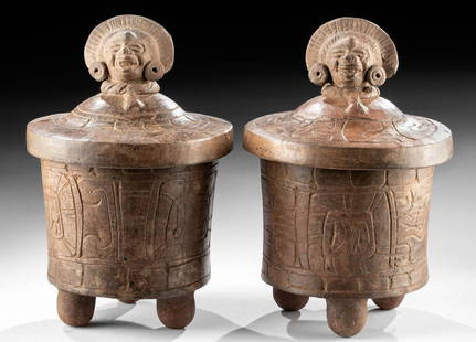 Maya Lidded Vessels w/ Deity Heads (matched pr): Pre-Columbian, Mexico and northern Central America, Maya Territories, Late Classic, ca. 550 to 900 CE. An incredible matched pair of lidded ceramic vessels of the style found in buried caches. The