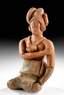 Naturalistic Maya Jaina Polychrome Seated Lord TL'd: Pre-Columbian, Jaina/Campeche Mexico, Maya, Late Classic Period, ca. 600 to 850 CE. A striking and lifelike seated terracotta figure of a lord with an elaborate, serpent-like headdress and a large