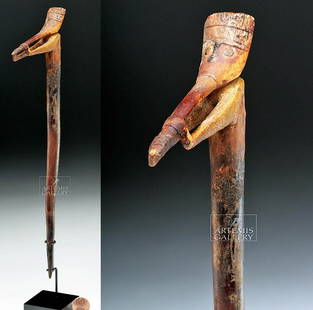 Pre-Columbian Paracas Camelid Bone Scepter - Shaman: Pre-Columbian, Peru (South Coast), Paracas culture, ca. 800 to 100 BCE. Camelid bone carved into the shape of a scepter or finial, capped by a dramatic human figure. The figure holds out a stick of