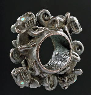 Huari Copper Ring w/ Running Jaguars, Inlaid Turquoise: Pre-Columbian, Peru, Huari/Wari, ca. 700 to 1000 CE. A masterful copper ring, its form adorned by four jaguars with inlaid turquoise eyes running around the perimeter. The wild felines' energetic