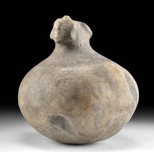 Mississippian Pottery Hooded Bottle w/ Human Face TL'd: Native American, Southeast or Midwest, Mississippian, ca. 520 to 1020 CE. A remarkable coil-made pottery vessel in a form best described as the "human-head" hooded bottle. The rotund dish presents a