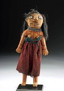 Early 20th C. Mojave Clay Female Doll w/ Hair & Beads: Native American, Fort Mojave/Mohave Indian Reservation, Mojave/Mohave people, ca. early 20th century CE. A charming female doll, hand-modeled from unfired clay and dressed in a skirt made from maroon