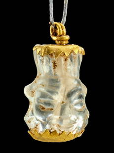 Egyptian Quartz Bes Head / Gold Amulet: Egypt, Late Dynastic to Ptolemaic Period, ca. 664 to 30 BCE. A beautiful amulet carved from quartz (also rock crystal) depicting the head of Bes, the dwarf deity known as a protector of women and