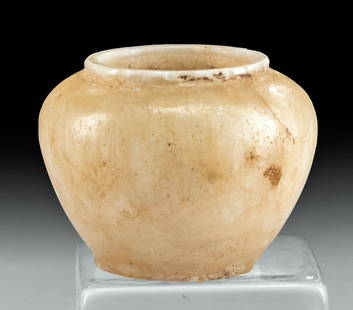 Near-Miniature Egyptian Alabaster Kohl Jar: Ancient Egypt, Late Dynastic Period, 26th to 31st Dynasty, ca. 664 to 332 BCE. A gorgeous jar of a near-miniature size, hand-carved from honey yellow alabaster, that is intended to hold small volumes