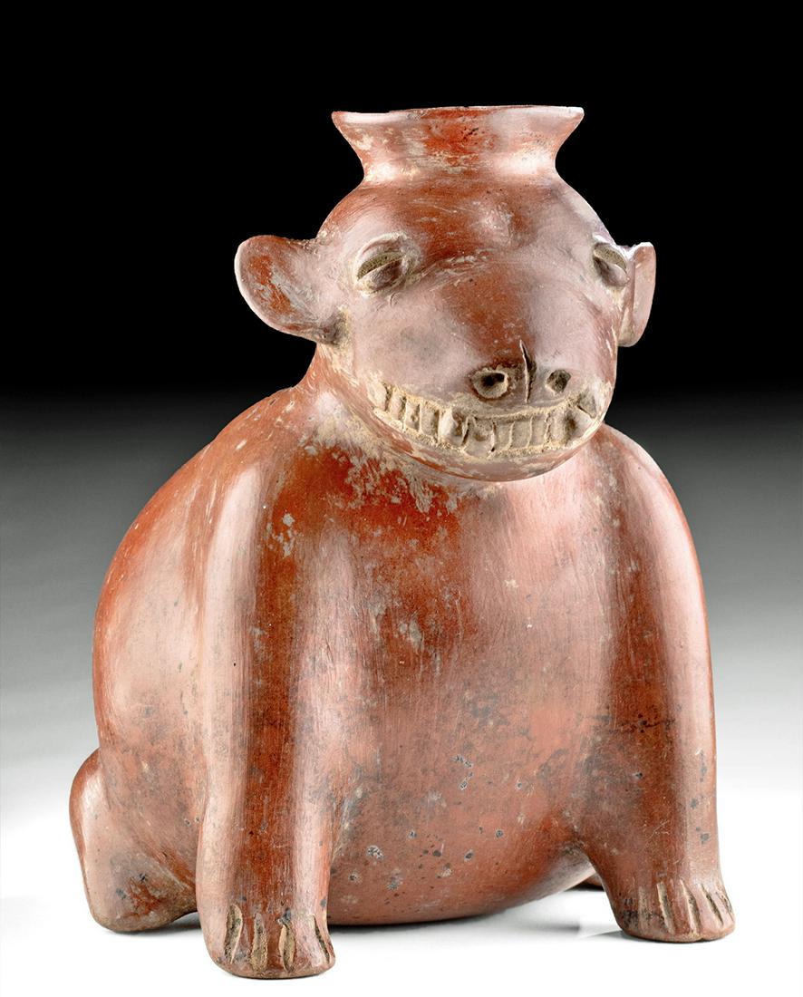 Colima Redware Dog Effigy Vessel Toothy Grin: Pre-Columbian, West Mexico, Colima, ca. 300 BCE to 300 CE. A charming example of one of the most famous artifacts of early western Mexico, a hand-built pottery dog vessel that is highly burnished and