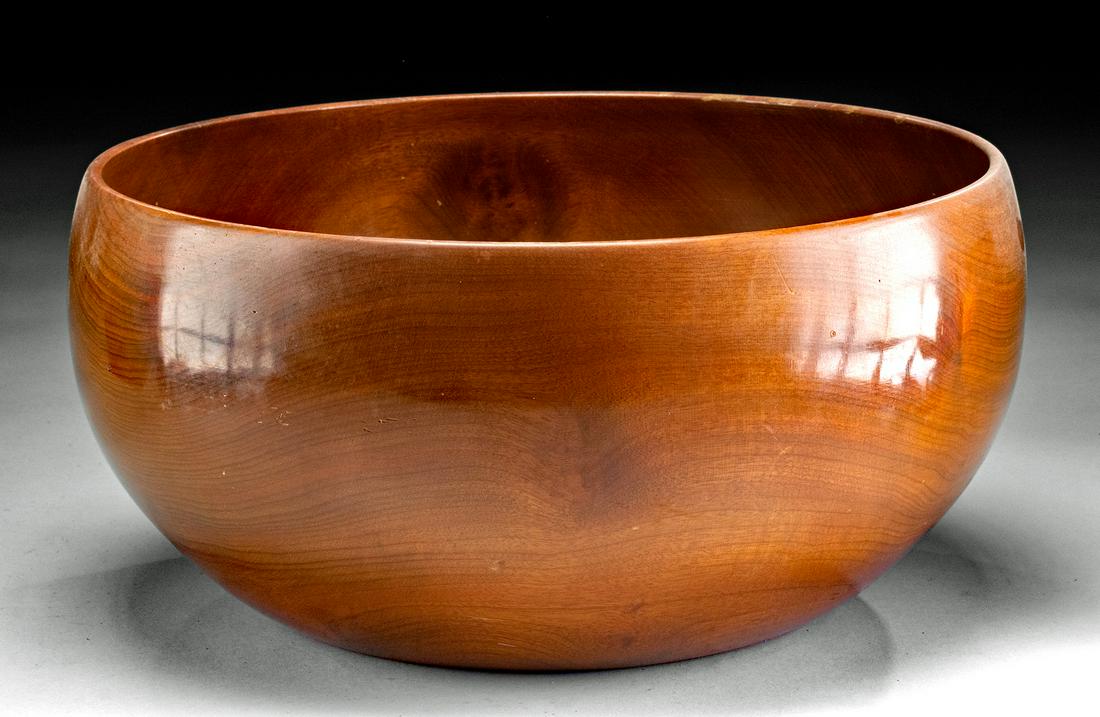 Huge Mid-20th C. Hawaiian Koa Wood Bowl: North Pacific, Hawaii, ca. 1950s. A stunning and sizable koa wood bowl showcasing a voluminous body and a circular rim that gently curves inwards, all sitting upon a planar base. A lustrous sheen enve