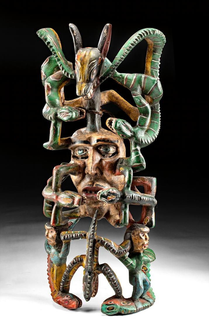 Large Mid-20th C. Mexican Polychrome Wood Mask: Latin America, Mexico, ca. mid-20th century CE. Wow! A stunning wood festival mask, skillfully carved into an elaborate openwork form and adorned with vibrant hues of emerald, lemon, crimson, cyan, po