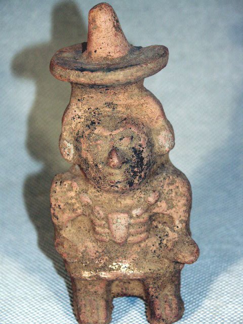 Mayan Male Effigy Whistle: Ca. 300 AD, from the ancient Mayan territories. An early pre-Classic example of a male wearing wide brim hat, single tone hole and mouth piece, 5-1/2"H.