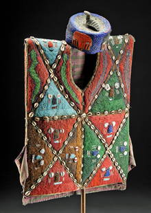 20th C. African Yoruba Beaded & Shell Hat & Tunic: West Africa, Nigeria, Yoruba Culture, ca. early to mid-20th century. A spectacular tunic and hat made from cotton cloth and covered with thousands of glass seed beads and shells to form colorful patte