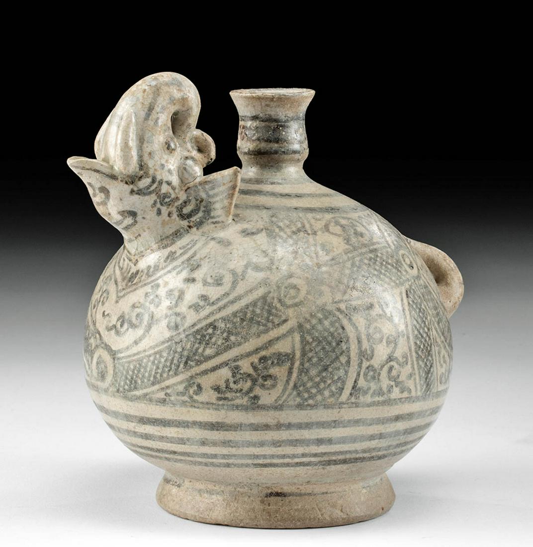 Anamese Pottery Wine Vessel w/ Elephant Spout & Tail: Southeast Asia, Vietnam, Anamese (sometimes Annamese), ca. 15th to 16th century CE. A charming pottery wine vessel is the form of an elephant with the head of the creature at one end and the tail at t