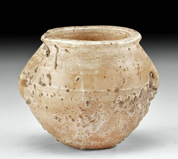 Egyptian Late Dynastic Banded Alabaster Jar: Egypt, Late Dynastic Period, 26th to 31st Dynasty, ca. 664 to 332 BCE. An attractive jar that is hand-carved from alabaster featuring a gently flared rim and apple-form body flanked by petite