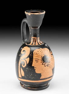 Greek Apulian Red Figure Lekythos w/ Profile of Woman: Magna Graecia, South Italic Colonies, Apulia, ca. 340 to 325 BCE. A wheel-thrown lekythos with an egg-shaped body atop a grooved discoid base, a rounded shoulder which tapers to a corseted