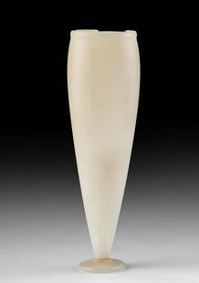 Delicate Egyptian Late Dynastic Alabaster Footed Vessel: Egypt, Late Dynastic to Ptolemaic Period, ca. 664 to 30 BCE. A stunning vessel hand-carved from alabaster and featuring a circular rim and thick walls that gradually taper to a narrow base, all