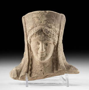 Greek Archaic Terracotta Protome of a Lady: Ancient Greece, Archaic, ca. 650 to 480 BCE. A mold-made terracotta protome representing a female head, wearing a flared hat draped in a lengthy veil that falls to her shoulders atop a centrally