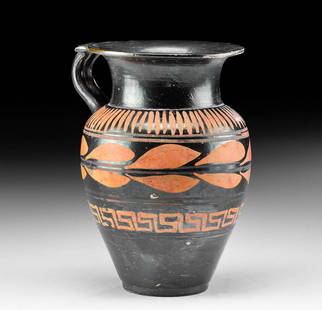 Greek Apulian Xenon Pottery Olpe w/ Abstract Designs: Magna Graecia, South Italy, Apulian, ca. 340 to 300 BCE. A beautiful, handled pottery vessel known as an olpe decorated in added red pigment on a lustrous black glaze. The ancient olpe displays a