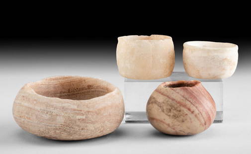 4 Egyptian Old Kingdom Alabaster Vessels - Jars & Bowl: Ancient Egypt, Old Kingdom, 3rd to 6th Dynasty, ca. 2686 to 2181 BCE. A fine collection of four vessels hand-carved from alabaster. The largest is a squat bowl with thick walls and a wide rim