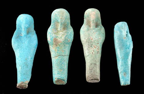 Four Petite Egyptian Glazed Faience Ushabti Figures: Egypt, Late Dynastic Period, 26th to 31st Dynasty, ca. 664 to 332 BCE. A nice gathering of four mold-formed faience ushabti figures of petite sizes that were perhaps part of a larger ensemble of