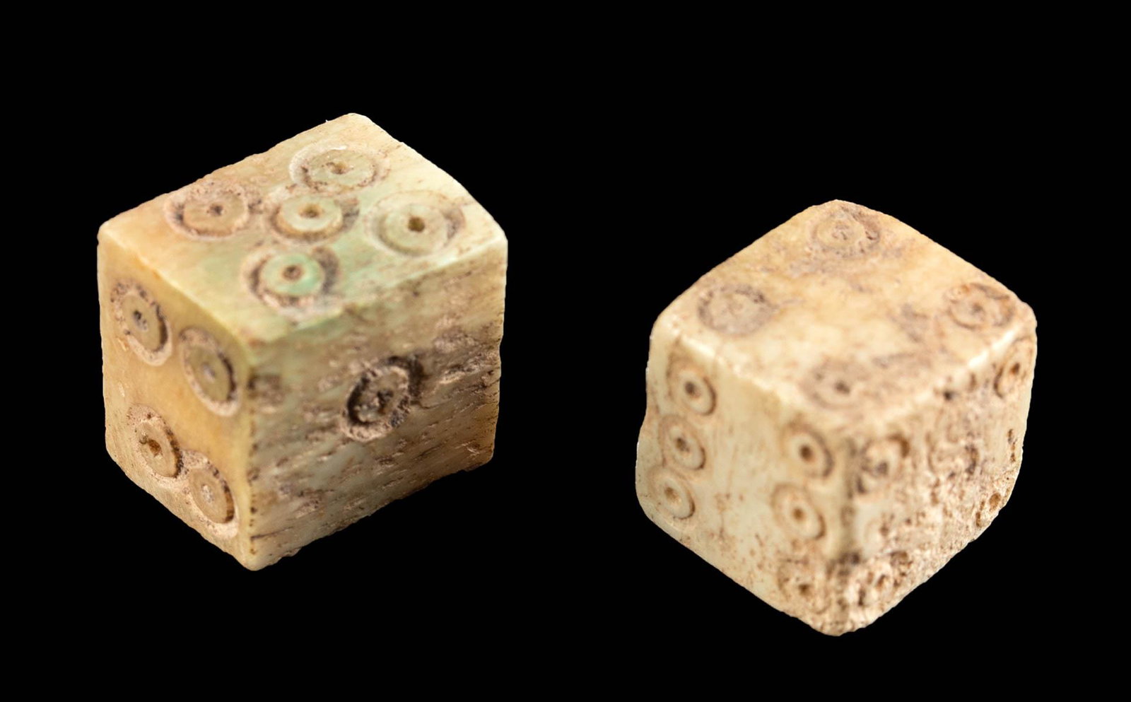 Pair of Roman Bone Carved Dice: **First Time At Auction** Roman, Imperial Period, ca. 2nd to 3rd century CE. A wonderful pair of ancient bone dice from a bovine or other ungulate. Each die is cube shaped with 6 faces, all with incis