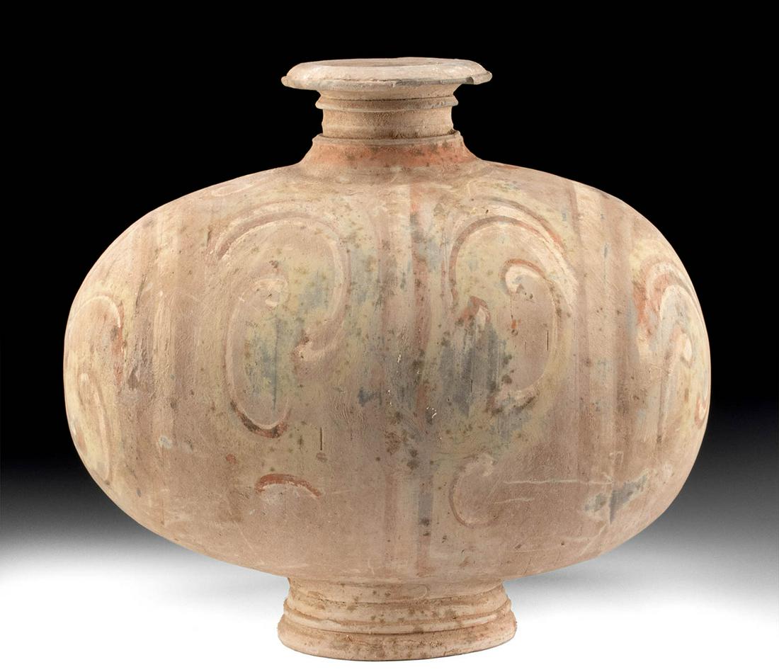 Chinese Han Dynasty Polychrome Cocoon Jar: East Asia, China, Han Dynasty, ca. 206 BCE to 220 CE. A hand-built pottery cocoon jar presenting a traditional egg-shaped, footed form with a flared spout rising from the center of the upper body. The