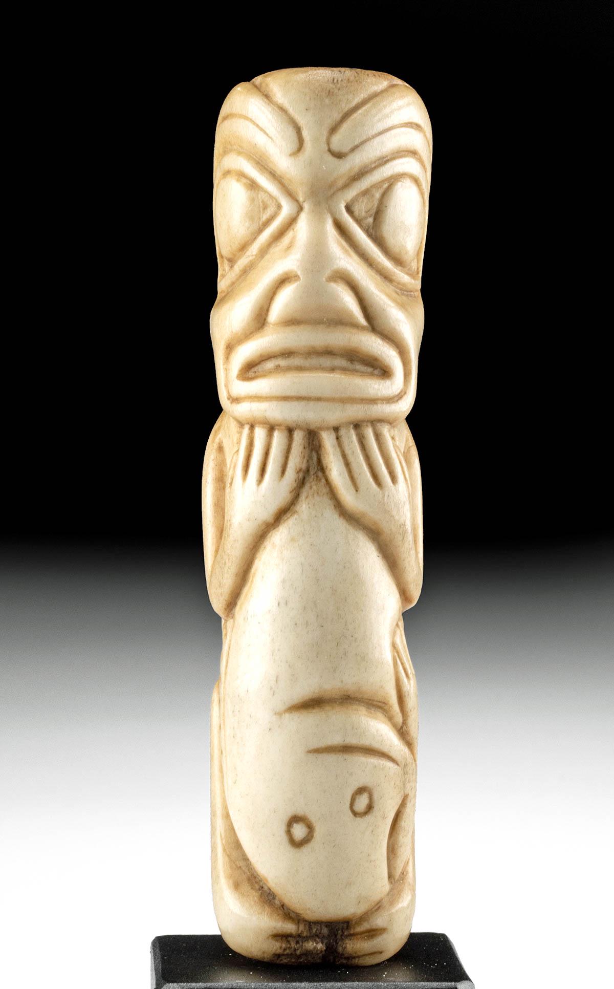 Early 20th C. Haida / Tlingit Bone Fishing Totem: Native American, North America, Pacific Northwest Coast, Haida or Tlingit, ca. early 20th century CE. A fine, hand-carved whale or walrus bone depicting an abstract and stylized figure with an anthrop