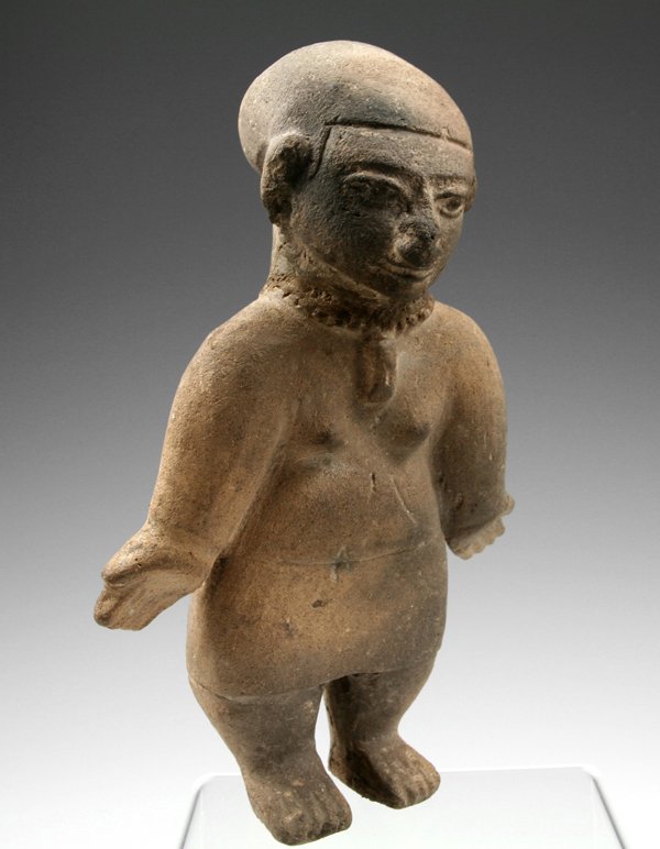 A Large Tumaco - La Tolita Female Figure: From the Tumaco - La Tolita culture, which covered ancient Southwest Coastal Colombia and Northwest Coastal Ecuador. Circa 300 B.C. - 300 A.D. Measuring approximately 8 1/2" tall and about 5-1/2" wide