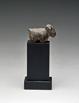 A Peruvian Early Formative Stone Sculpture: Chavin, ca. 1200 - 500 B.C. Stone carving of a llama (this is the forerunner of the Inca Canopas. Modern museum-quality mount. 1-1/2"W x 1"H. PROVENANCE: Ex-private Southwestern USA Collection. (no re