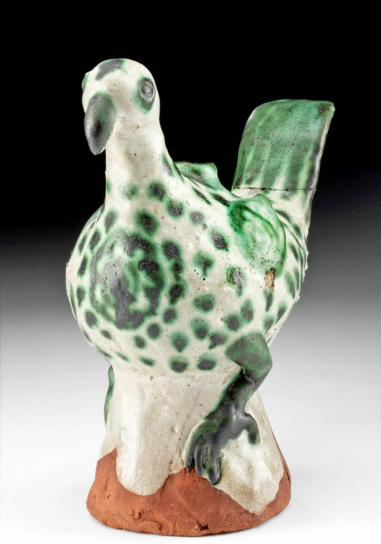 14th C. Burmese Glazed Bird Vessel, ex-Museum: Southeast Asia, Burma (Myanmar), ca. 14th century CE. A delightful pottery water vessel in the form of a bird standing upon an integral base. The bird’s clawed feet straddle the sides of the hol