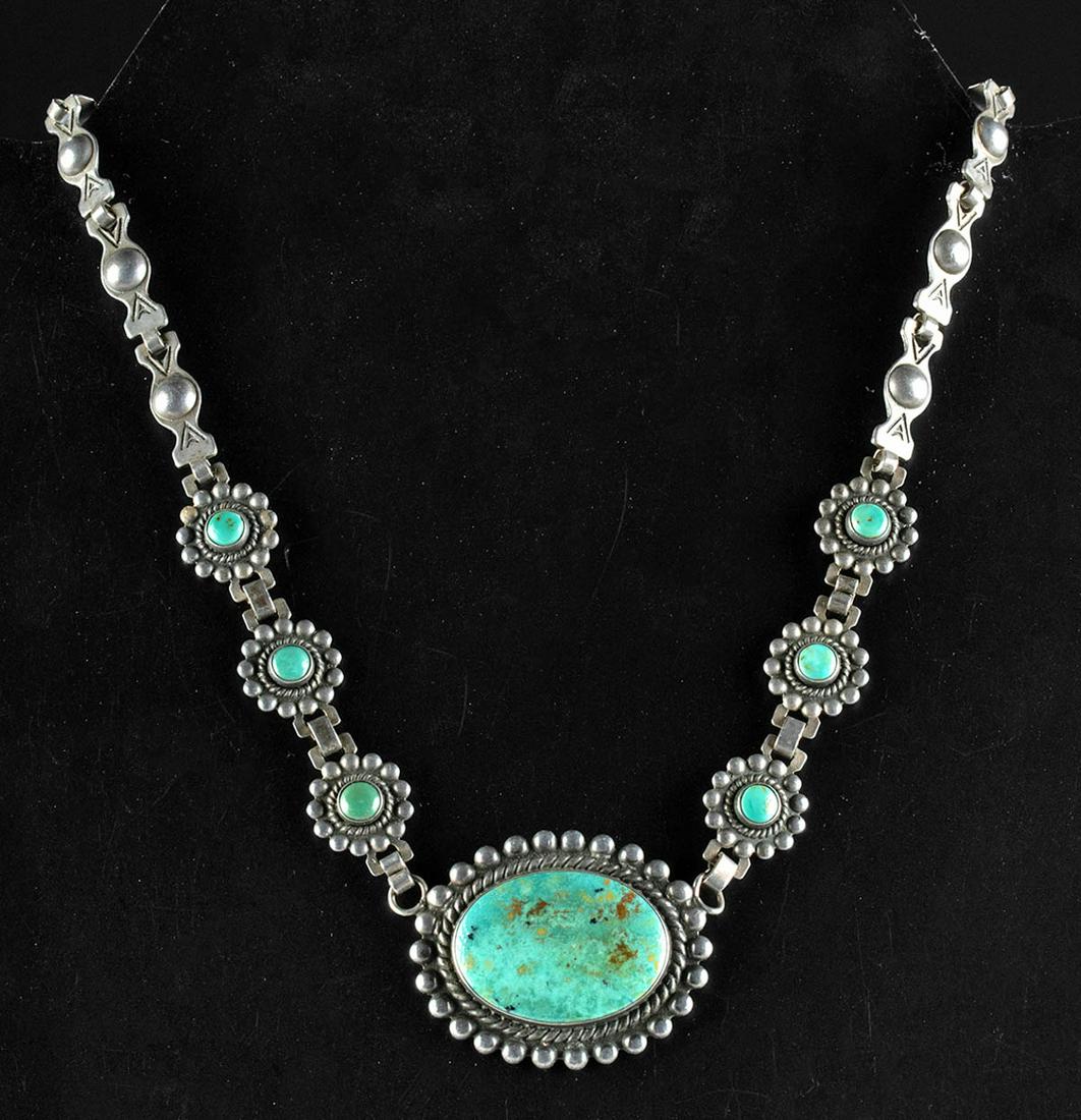 20th C. Navajo Silver & Turquoise Choker Necklace: Native American, Southwestern United States, Navajo, ca. mid-20th century CE. A beautiful sterling silver and Royston turquoise necklace comprised of linked segments and bezels. The terminal ends have