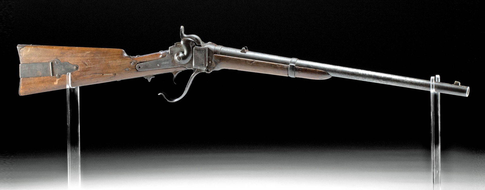 1859 American Iron & Wood Sharps Breechloading Carbine: North America, United States, ca. 1859 CE. A handsome carbine or short rifle known as a Sharps Model 1859 with a lengthy iron barrel, a bulky wooden stock, and iron fittings. Boasting a dropping block