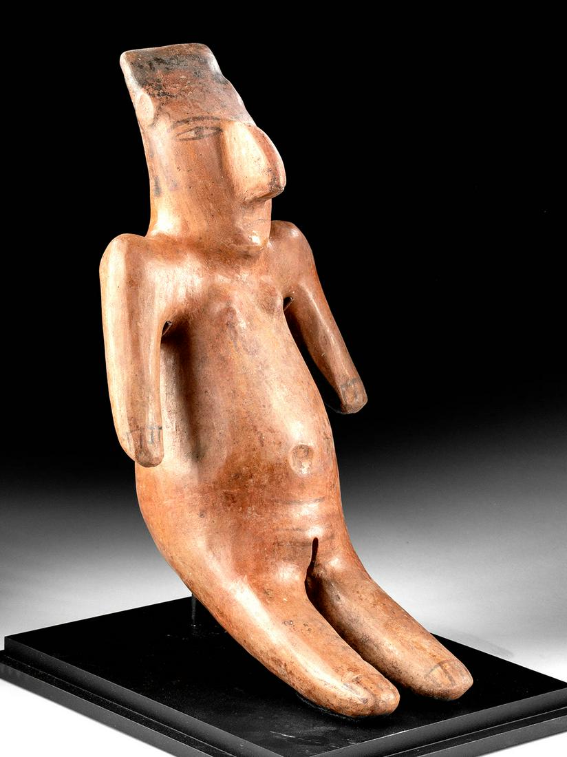 Rare / Huge Nazca Polychrome Sitting Venus Figure: **Originally Listed At $2000** Pre-Columbian, South Coast Peru, Nazca culture, ca. 200 to 600 CE. A stunning ceramic female Venus figure of an exceedingly rare size. The nude figure presents seated up