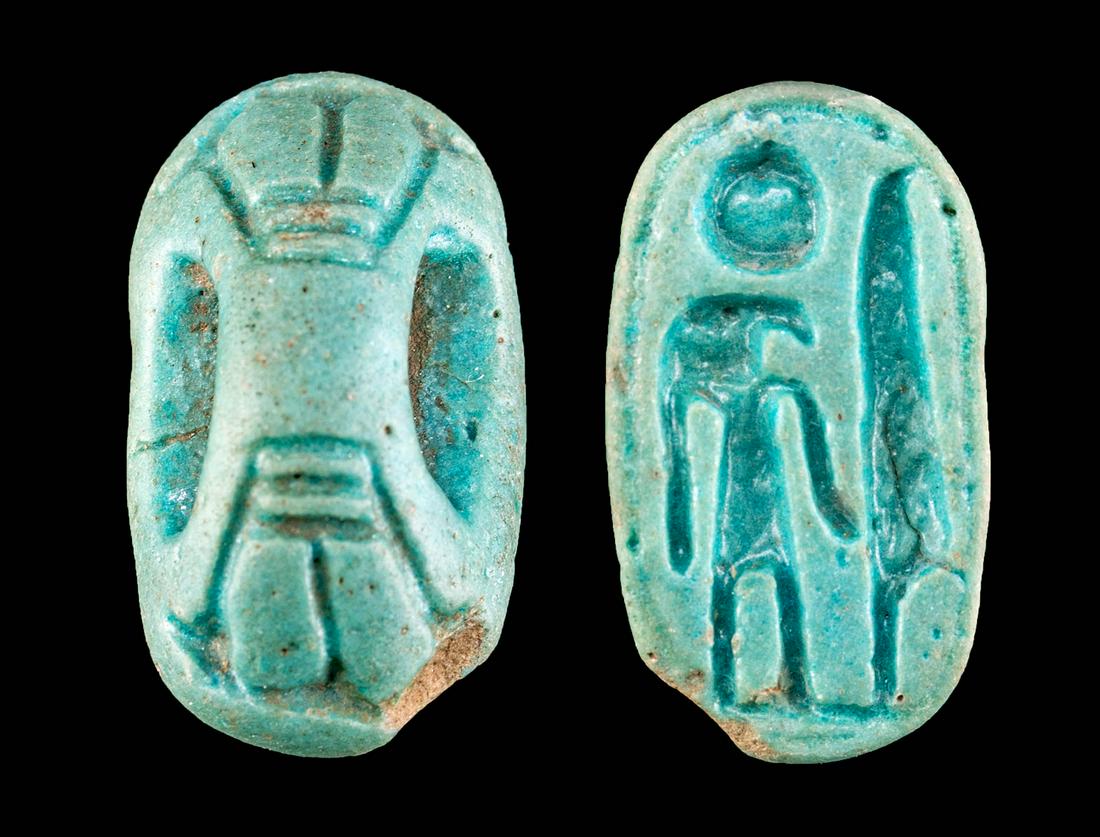 Egyptian Faience Stamp Seal w/ Fly Handle: **First Time At Auction** Ancient Egypt, late New Kingdom to Third Intermediate Period, 19th to 25th Dynasty, ca. 1200 to 700 BCE. A hand-built faience stamp seal of an ovoid form with a perforated ha