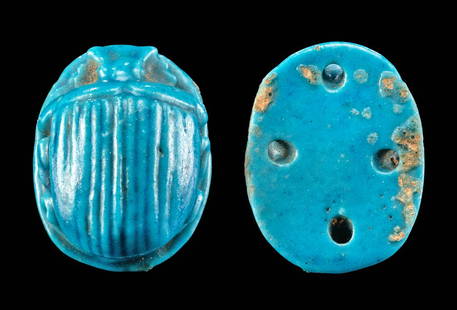 Egyptian Glazed Faience Scarab Attachment for Mummy: Egypt, Late Dynastic to Ptolemaic Period, ca. 664 to 30 BCE. A mold-formed faience scarab attachment of a round-topped form that is enveloped in layers of lustrous, brilliant blue glaze. The insect