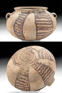 Egyptian Predynastic Painted Pottery Jar, ex-Sotheby's: Ancient Egypt, Pre-Dynastic Period, Naqada II, ca. 3400 to 3200 BCE. A hand-built earthenware vessel of a globular form, the body decorated throughout with red pigment in a series of vertical panels